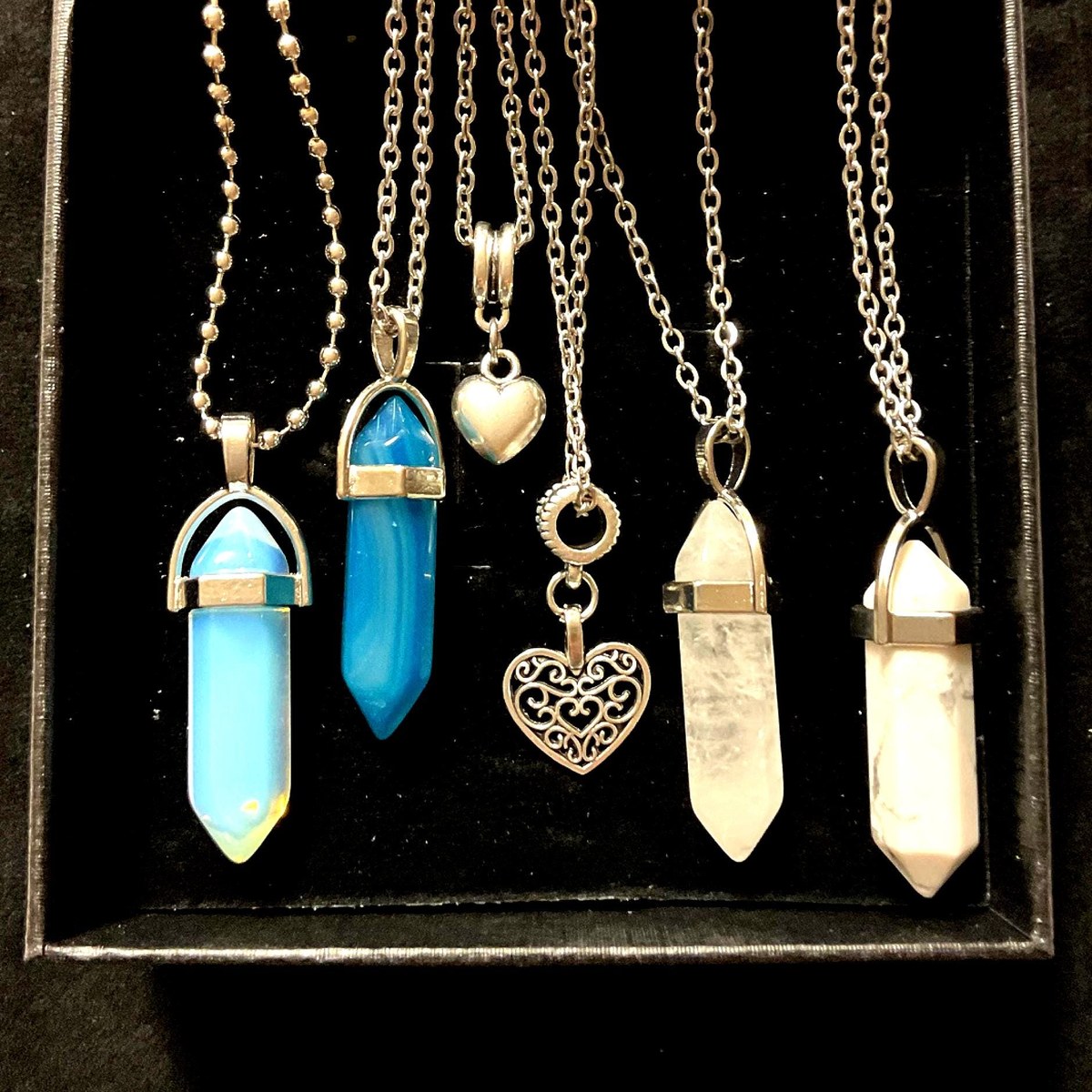 Crystal necklace set featuring opalite, agate, and quartz pendants with heart charms